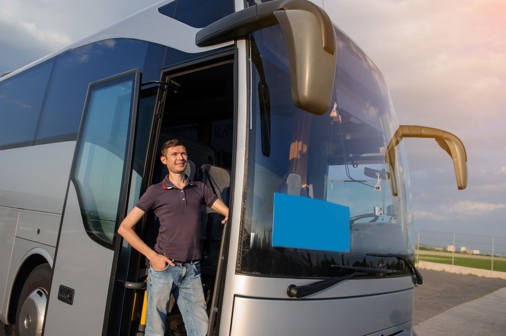 Driver,Staying,In,The,Front,Door,Of,His,Bus.,Happy