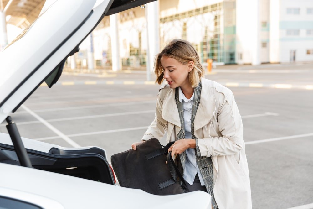 Photo,Of,Caucasian,Blonde,Businessman,In,Formal,Wear,Putting,Bag